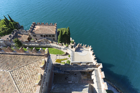 MALCESINE, ITALY - SEPTEMBER 30, 2018: 13th-century medieval stone Scaliger Castle (Castello Scaligero) on Lake Garda, Province of Veronaのeditorial素材