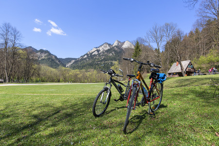 DUNAJEC RIVER GEORGE, POLAND - APRIL 20, 2019: View on Three Crowns Massif from the side of the Red Monastery, Pieniny Mountains, tourist bikesのeditorial素材
