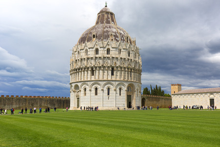 PISA, ITALY - MAY 13, 2019: Tourists before Pisa Baptistery of St. John, Piazza del Duomoのeditorial素材
