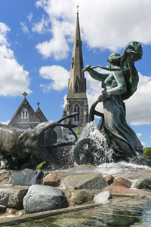 COPENHAGEN, DENMARK - JUNE 22, 2019 : St. Alban Church and Gefion Fountain located in port in Nordre Toldbod area next to Kastelletのeditorial素材