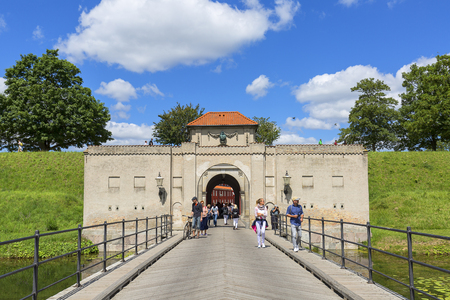 COPENHAGEN, DENMARK - JUNE 22, 2019 : Old Citadel, Kastellet, view on bridge and King Gate in sunny dayのeditorial素材