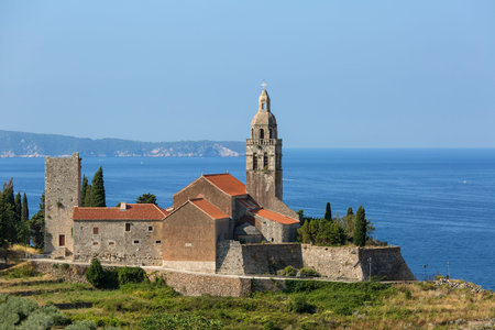 12th century coastal town lying on the island of Vis on the Adriatic Sea, view on Church of Saint...