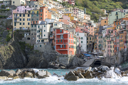 RIOMAGGIORE, CINQUE TERRE - ITALY, MAY 12, 2019: View on seaside and typical colorful houses in small village, Riviera di Levanteのeditorial素材