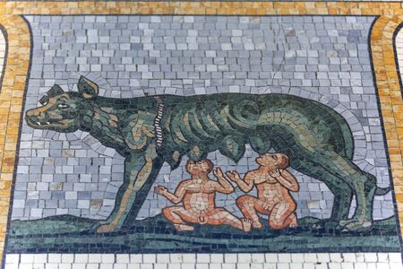 MILAN, ITALY - SEPTEMBER 28, 2018: Gallery Vittorio Emanuele II, luxury shopping mall. Decorative floor, colorful mosaic with a she-wolf. Gallery was designed and built by architect Giuseppe Mengoni between 1865 and 1867のeditorial素材