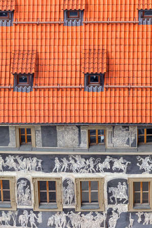 Prague, Czech Republic - May 1, 2017: Renaissance "House under a minute" decorated with technique sgraffito scenes from Greek mythology , Old Town Squareのeditorial素材