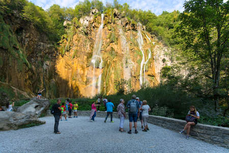 Plitvice Lakes, Croatia - September 2, 2019:  Plitvice Lakes National Park, a miracle of nature, tourists admiring the great waterfallのeditorial素材