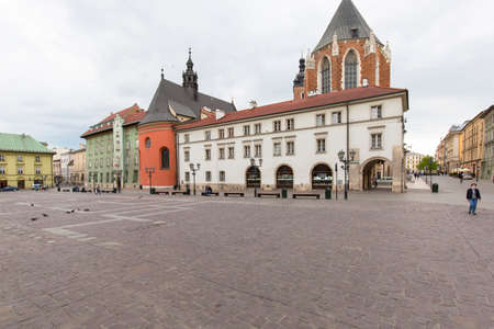 Krakow, Poland - May 2, 2010: Small Market Square, a deserted city due to the coronavirus epidemic, no tourists, closed restaurants and shops. Closed state bordersのeditorial素材