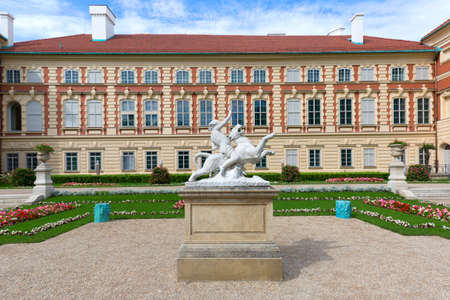Lancut, Poland - August 26, 2020: 16th century baroque Lancut Castle, former Polish magnate residence. Italian Garden - sculpture of Bacchus on the pantherのeditorial素材