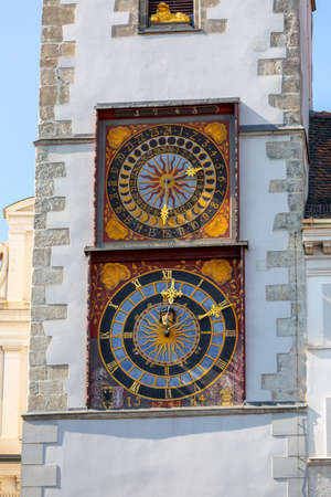 Clock with two dials and city hall lion on the tower of the 14th century Old Town Hall at Lower Market Square (Untermarkt)のeditorial素材
