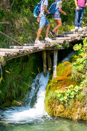 Plitvice Lakes, Croatia - September 2, 2019: Plitvice Lakes National Park, a miracle of nature, tourists walking on the wooden bridgeのeditorial素材