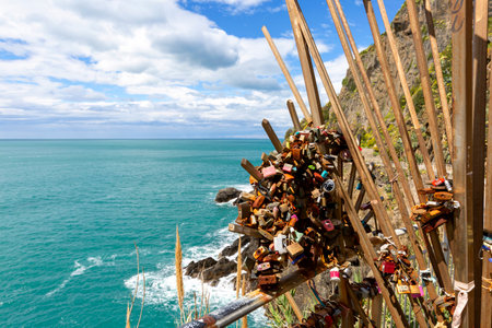 Riomaggiore, Cinque Terre - Italy, May 12, 2019: Love locks on the gate to Azure Path (Path of Love), walking trail leading through five towns of Cinque Terre, Italian Rivieraのeditorial素材