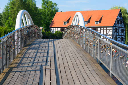 Bydgoszcz, Poland - June 26, 2020: Footbridge, bridge of Lovers over Brda River on Mill Islandのeditorial素材