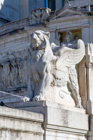 Statue of winged lion in frint of Victor Emmanuel II Monument on Venetian Square, Rome, Italy. The mythological cat theme is a symbol of power and authorityのeditorial素材