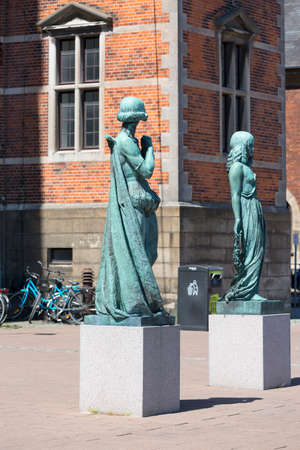 Helsingor, Denmark - July 23, 2019: Sculptures of women in front of facade of renaissance building of Helsingor station on the Baltic Sea over the Oresund Straitのeditorial素材