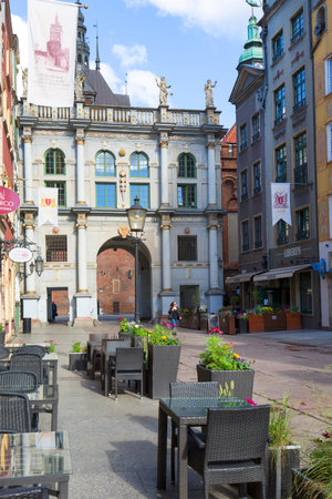 Gdansk, Poland - June 6, 2018: Long street with Golden Gate, street life