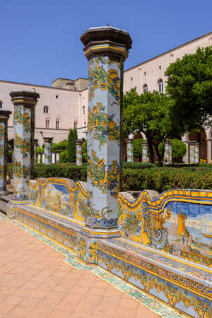 Naples, Italy - June 27, 2021: Cloister Santa Chiara with octagonal columns decorated with majolica tiles in rococo style with floral patternsのeditorial素材