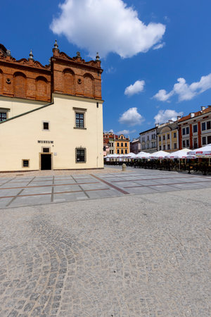 Tarnow, Poland - July 24, 2021: Town square with red brick building of Town Hall. The market was founded in the 14th century during the location of cityのeditorial素材