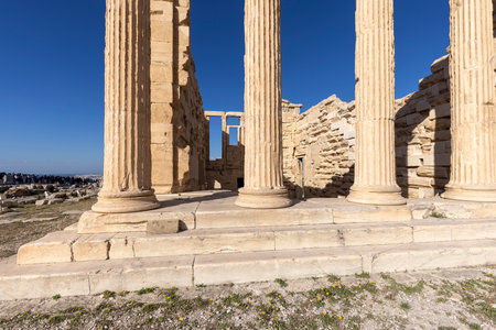 Athens, Greece - October 17, 2022: Erechtheion, Temple of Athena Polias on Acropolis of Athens. View Ionic style columns on a background of blue skyのeditorial素材