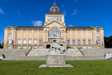 Szczecin, Poland - September 16, 2022: Main mach of National Museum of Szczecin located on Chrobry Embankment. Sculpture Hercules fighting a centaur by Ludwig Manzel in front of buildingのeditorial素材