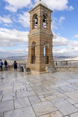 Athens, Greece - October 18, 2022: Observation deck on top of Mount Lycabettus with bell tower of Saint George's chapel, aerial view of the city. Peak is the highest point in Central Athensのeditorial素材