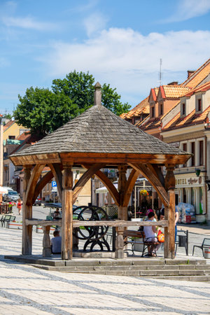 Sandomierz, Poland - July 10, 2020: View on market with old wooden well. Sandomierz is known for its Old Town, which is a major tourist attraction.のeditorial素材