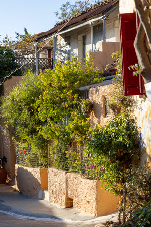Anafiotika, scenic tiny neighborhood of Athens, part of the old historical district Plaka, narrow streets, Athens, Greece. It is a traditional village located at the foot of the Acropolisの写真素材