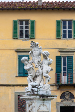 Pisa, Italy - May 13, 2019: 17th century Fountain with Angels (Fontana dei Putti) located in Piazza del Duomo next to Pisa Cathedral and Leaning Tower of Pisaのeditorial素材