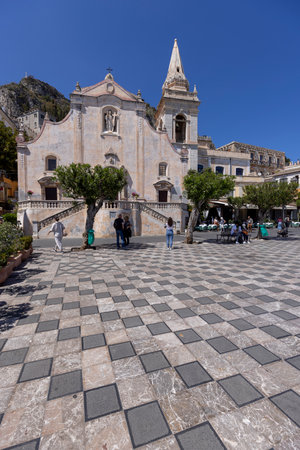 Taormina, Sicily, Italy - April 28, 2023: 17th century Church of San Giuseppe with bell tower on Piazza IX Aprile, main square in the city.のeditorial素材