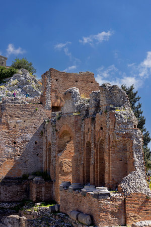 Taormina, Sicily, Italy - April 28, 2023: Ancient theater of Taormina (Teatro antico di Taormina), ruins of ancient Greek theatre, built in Hellenistic era with a view of Mount Etna volcanoのeditorial素材