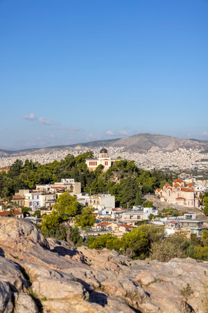 Athens, Greece - October 17, 2022: Aerial view of city with neoclassical building of National Observatory of Athens on Mouseion Hill. It is a research institute founded in 1842のeditorial素材