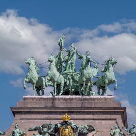 Brussels, Belgium - May 16, 2023: Statue of quadriga on the top of triumphal arch Cinquantenaire Arch in Cinquantenaire Parkのeditorial素材