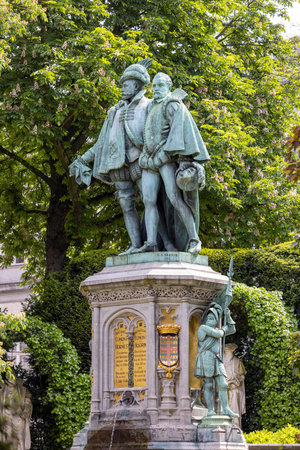 Brussels, Belgium - May 18, 2023: Fountain statue in honour of the Counts of Egmont and Hornes, 16th century resistance fighters in renaissance garden of Square of Petit Sablonのeditorial素材