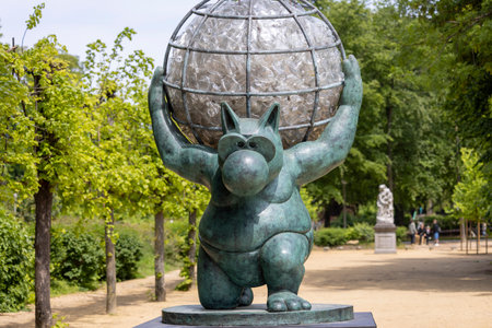 Brussels, Belgium - May 18, 2023: One of the sculpture of the famous belgian comic book character of a big cat, Le Chat in Royal Park. Character created by Philippe Geluckのeditorial素材
