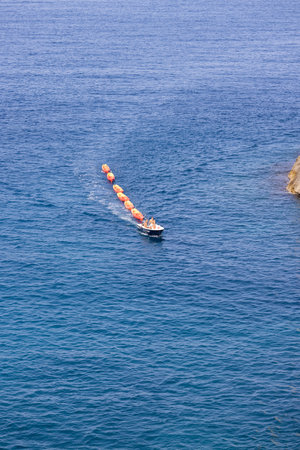 Dubrovnik, Croatia - June 27, 2023: Transportation of colorful kayaks for tourists by water on the...