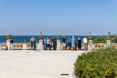Trieste, Italy - September 26, 2023: Tourists admiring the picturesque sea view from terrace in front of Miramare Castleのeditorial素材