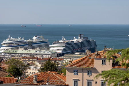 Trieste, Italy - September 26, 2023: Aerial view from San Giusto Hill of city and port for ships, large passenger ferries moored in the portのeditorial素材