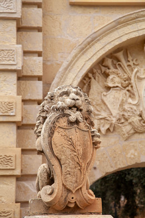 Mdina, Malta - October 24, 2015: Statue of lion with symbol of Mata in front of medieval Mdina Gateのeditorial素材