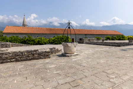 Budva, Montenegro - June 28, 2023: Medieval fortress of St. Mary, also known as the Citadel. View of the courtyard with the historic wellのeditorial素材