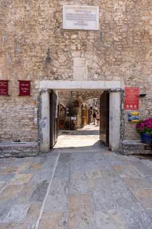 Budva, Montenegro - June 28, 2023: Old Town Walls with Main Gate and relief of lion of Saint Mark at facadeのeditorial素材