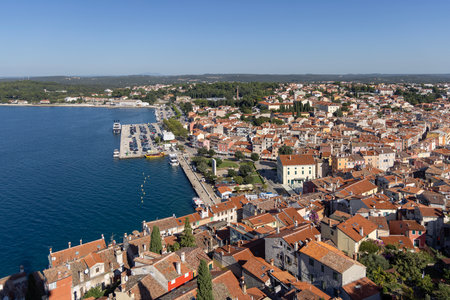 Rovinj; Croatia; Istria - September 29; 2023: Aerial view from bell tower of Saint Euphemia Church of city and coast of Adriatic Sea. Typical red ceramic roof tileのeditorial素材