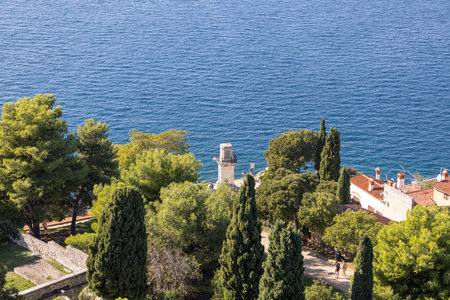 Rovinj; Croatia; Istria - September 29; 2023: Aerial view from bell tower of Saint Euphemia Church of Adriatic Sea with lighthouseのeditorial素材
