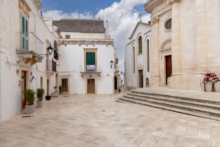 Locorotondo, Italy, Puglia - May 20, 2024: Piazza Fra Giuseppe Andrea Rodio with 18th century Church of Saint George Martyr. It is dedicated to San Giorgio, the patron saint of the cityのeditorial素材