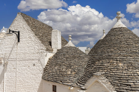 Alberobello, Puglia, Italy - May 21, 2024: Trulli houses, traditional, unique Apulian dry stone hut with a conical roof. The trulli are included in the UNESCO World Heritage Listのeditorial素材