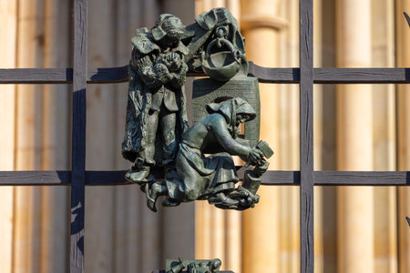 Prague, Czech Republic - September 3, 2024: Decorative figurines on the metal fence of the Golden Gate of medieval St. Vitus Cathedral, located on Hradcanyのeditorial素材