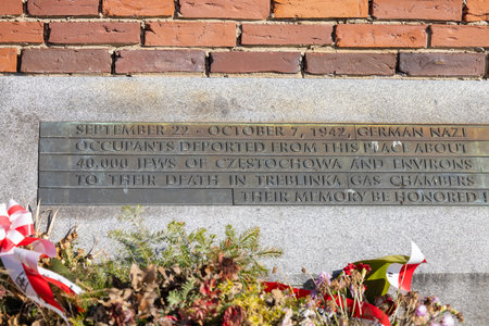 Czestochowa, Poland - October 18, 2024: Monument to Jews of Czestochowa, commemorates 40,000 Jews murdered in the Treblinka death camp. Star of David made of railway rails, crack in red brick wallのeditorial素材