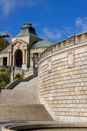 Szczecin, Poland - September 16, 2022: Fountain at Chrobry Embankment (Hakena Terrace), coats of arms of Polish cities on the wall. South Rotunda in a distanceのeditorial素材