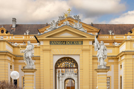 Melk, Austria - February 24, 2023: Melk Abbey on hill above town, main entrance. It was founded in 11th century, today's baroque abbey was built in 18th centuryの写真素材