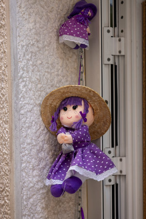 Budva, Montenegro - June 28, 2023: Shop with dried lavender, little doll on shop window in a purple dress with a bag of lavender in her handの写真素材