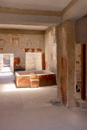 Pompeii, Naples, Italy - June 26, 2021: Laundry of Stephanus house (Fullonica di Stephanus) interior with stone bathtubの写真素材