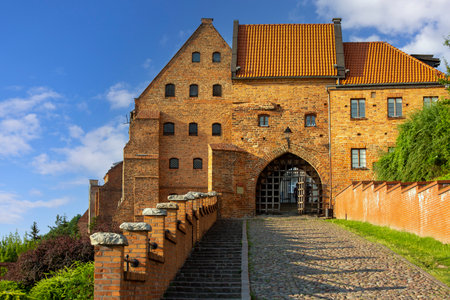Grudziadz, Poland - June 25, 2023: 14th century Grudziadz Granaries, fortification complex of river bank on the Vistula river. View of Water Gateのeditorial素材